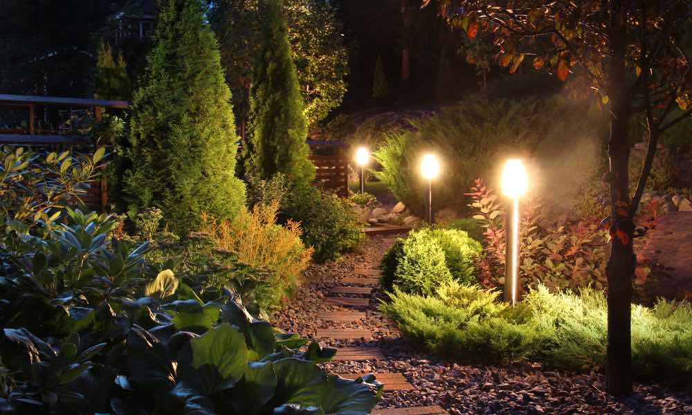 Lamps adorn this rustic yard and pathway thanks to Hot Shot Sprinkler Repair & Landscape's landscaping services in Utah.