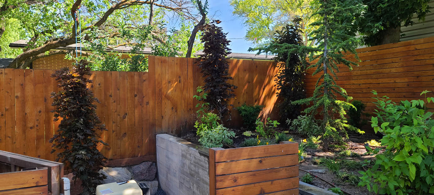 A picture of a backyard with zeroscaping - learn more about Hot Shot, one of the leading sprinkler companies in Utah County, UT.